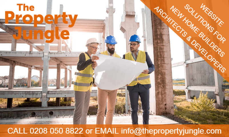 Builders and Architects looking at plans on a building site